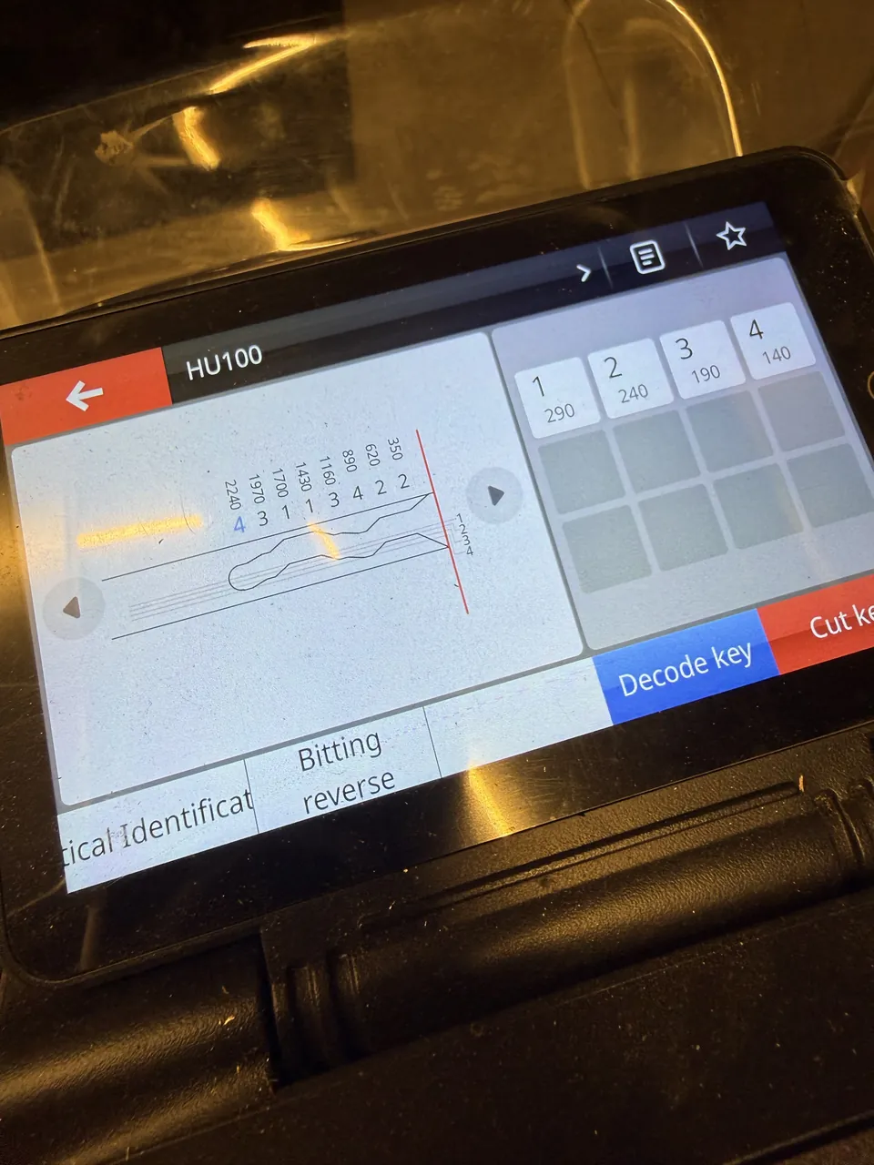 Automotive key code displayed on locksmith equipment